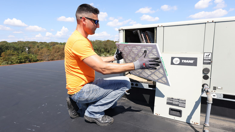 Man installing air filter