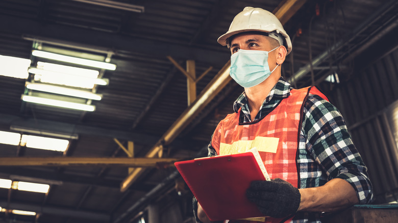 Factory worker wearing face mask