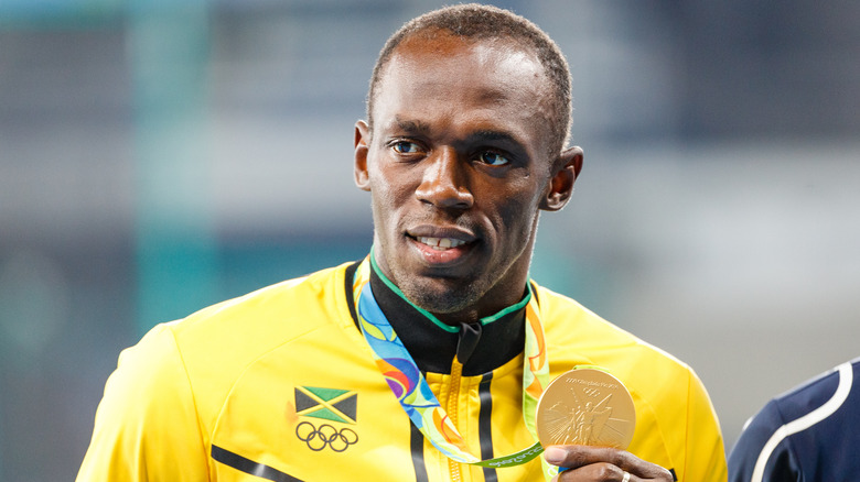 Usain Bolt with Olympic medal