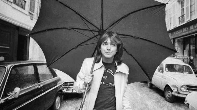 David Cassidy holding umbrella