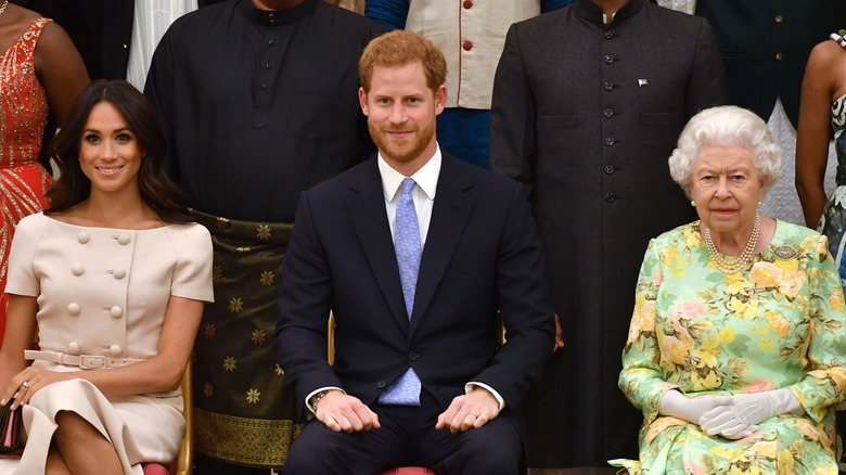 Meghan Markle Prince Harry Queen Elizabeth II smiling