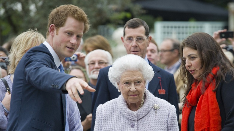 Prince Harry talking with Queen Elizabeth II