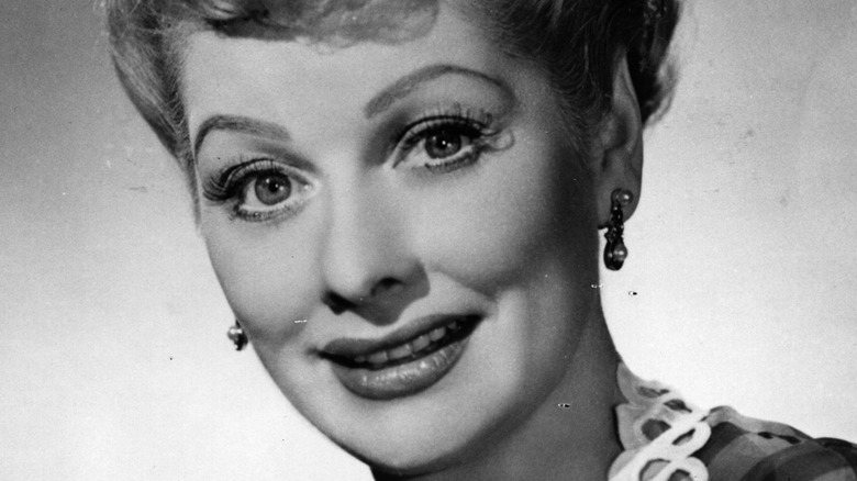 Lucille Ball smiles, photo is black and white