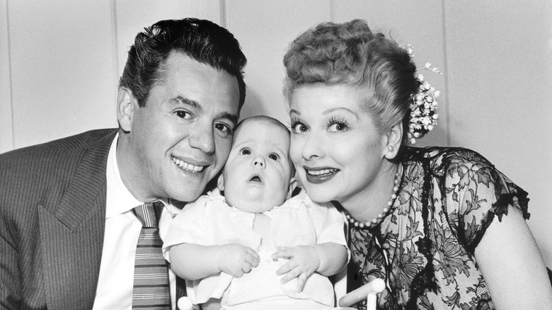 Lucille ball, Desi Arnaz and their young son smile, Black and white photo 