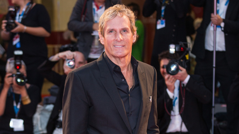 Michael Bolton wearing black suit 