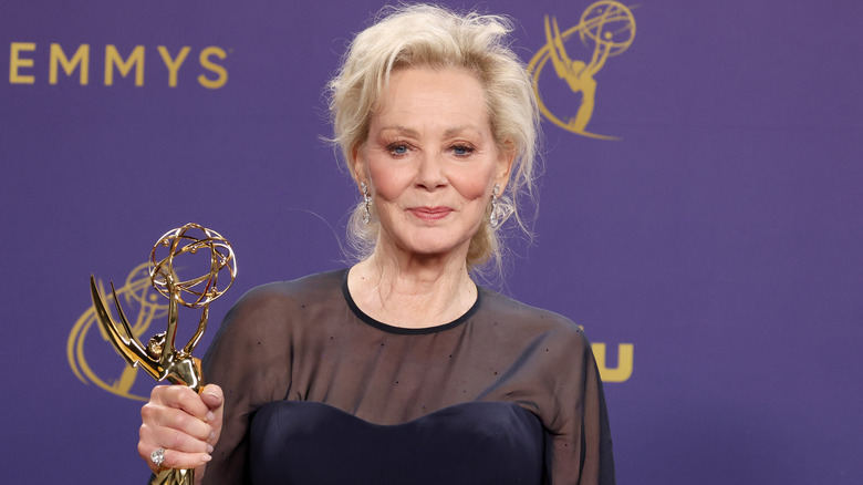 Jean Smart posing with her Emmy Award