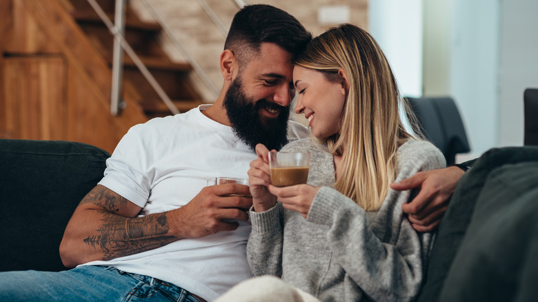 couple snuggling on couch