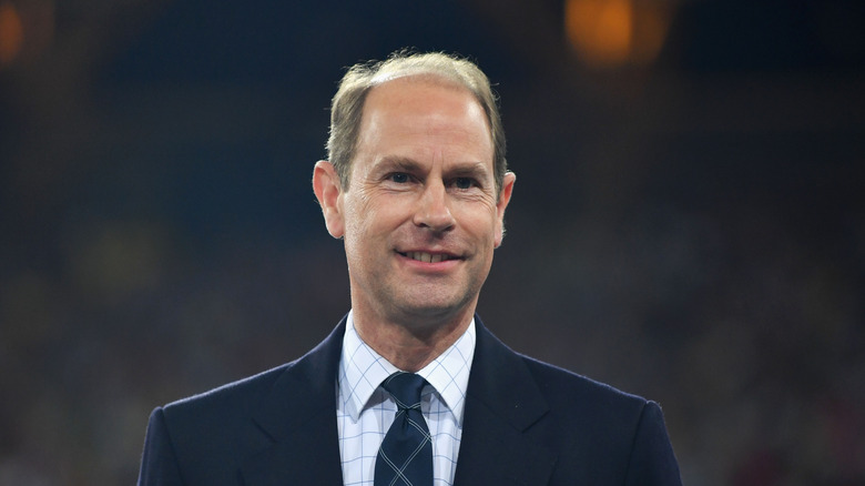 Prince Edward wearing suit smiling