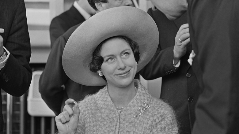 Princess Margaret smiling in large hat