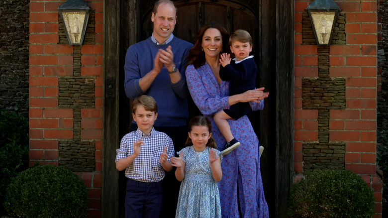 William and Kate with their children outside front door