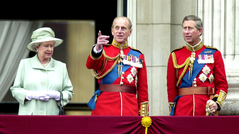 Prince Philip, the Queen, and Prince Charles on balcony