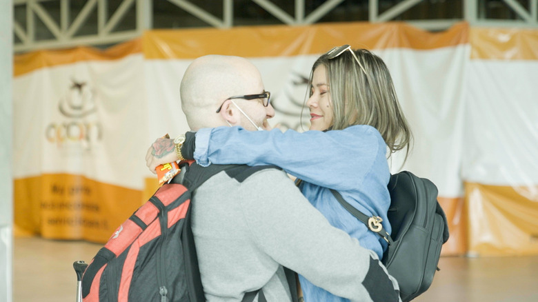 Mike and Ximena smiling and embracing