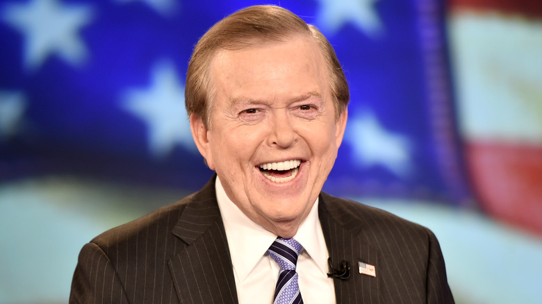 A smiling and happy Lou Dobbs