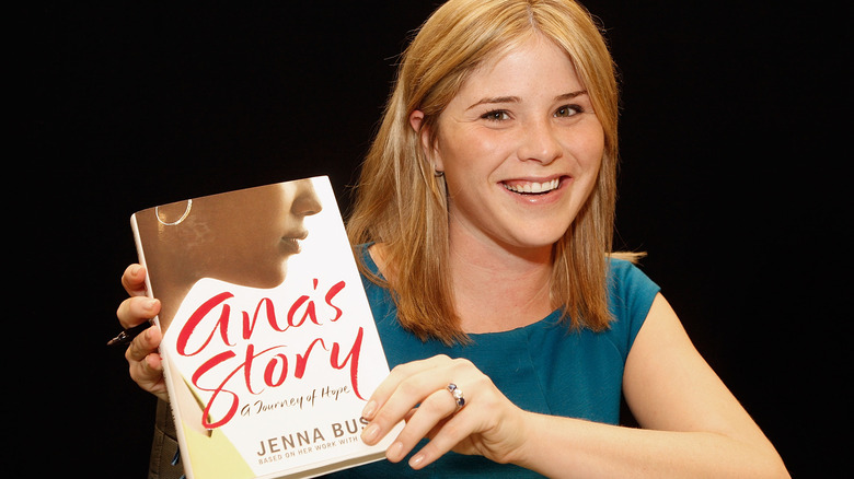Jenna Bush Hager holding up her first book