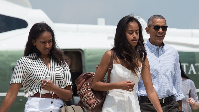 Obama sisters Malia and Sasha, and Barack Obama