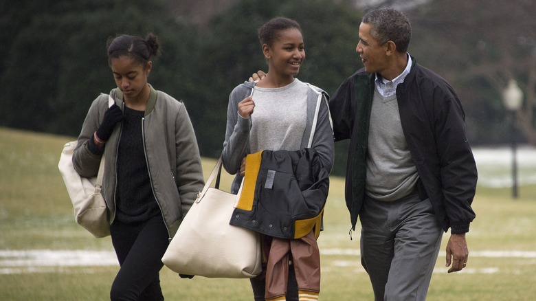 Obama sisters Sasha and Malia, and Barack Obama