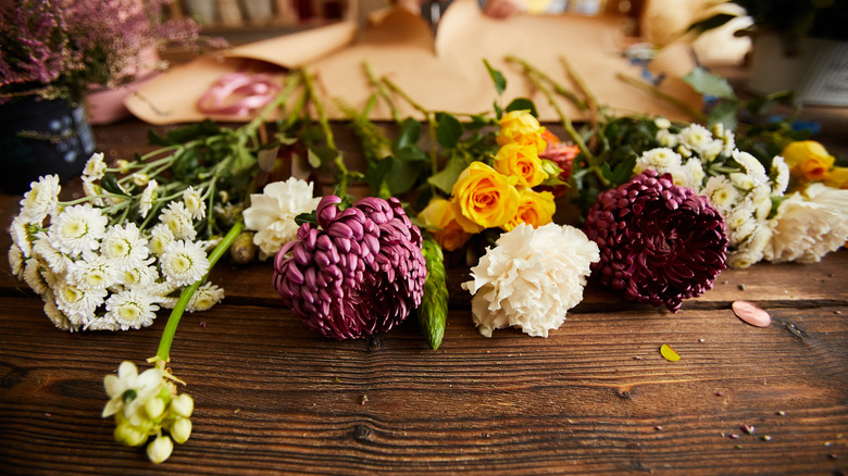 Flowers laid out on wooden table