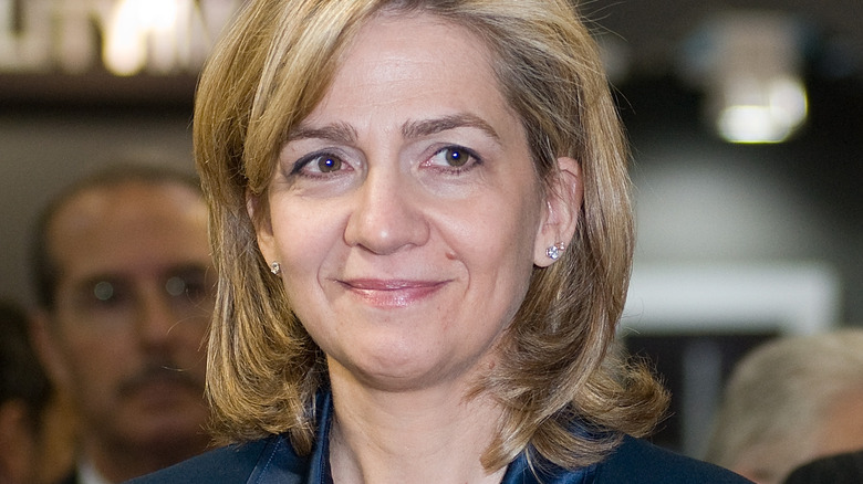 Princess Cristina smiling at distant object