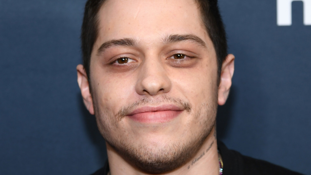 Pete Davidson smiles