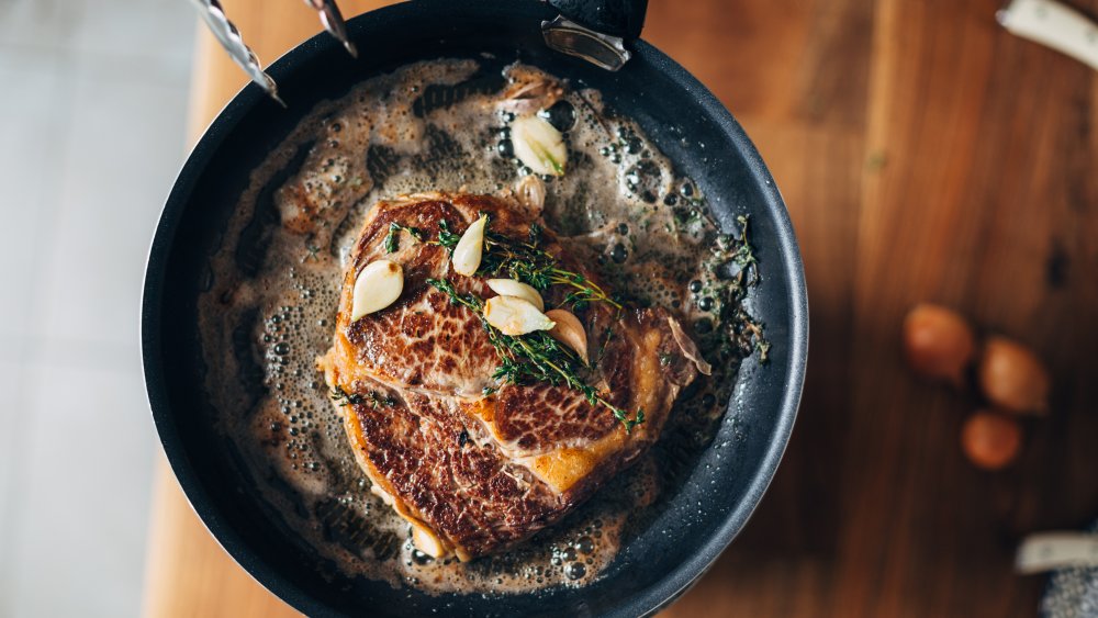 ribeye steak in a pan