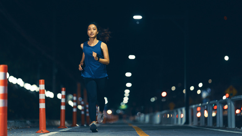 Woman jogging at night