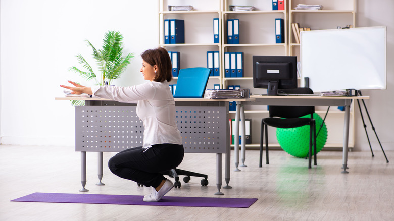 Woman doing a workout in the office