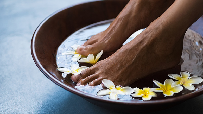 Woman soaking her feet