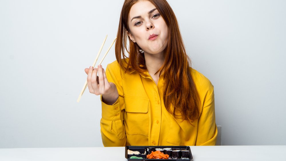 Woman eating salmon