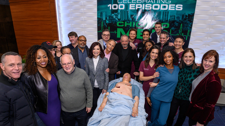 Cast and crew of "Chicago Med" celebrating their hundredth episode