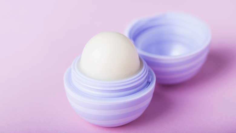 Purple eos lip balm with the lid open