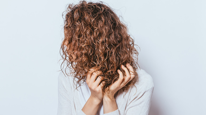 Woman preparing hair for bleaching