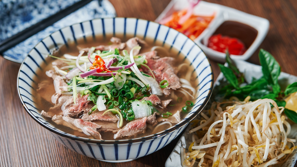 Bowl of pho on table