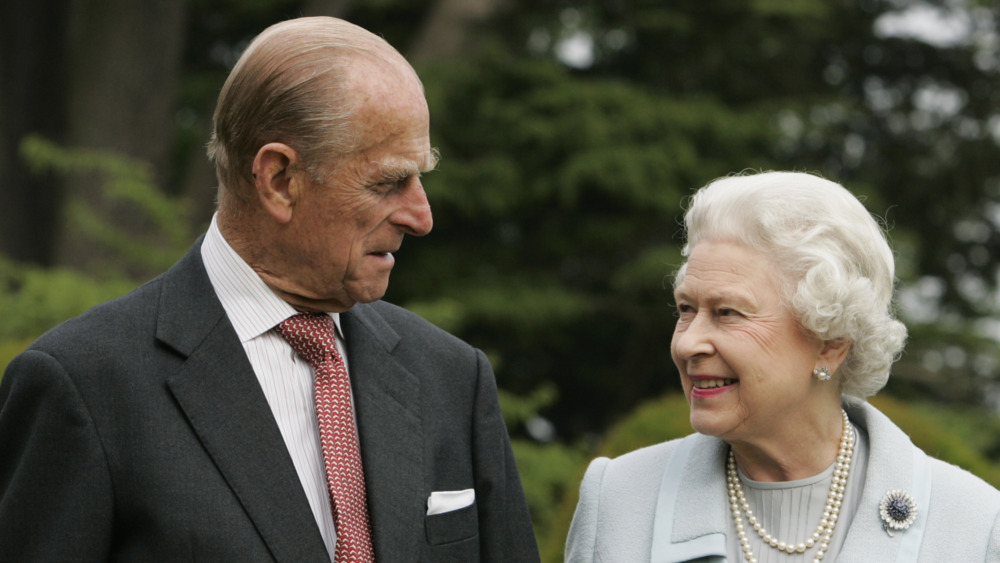 Queen Elizabeth and Prince Philip smiling 