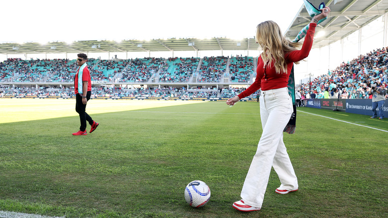 Brittany and Patrick Mahomes on soccer field