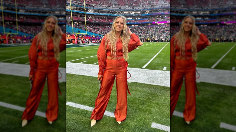 Brittany Mahomes posing on football field