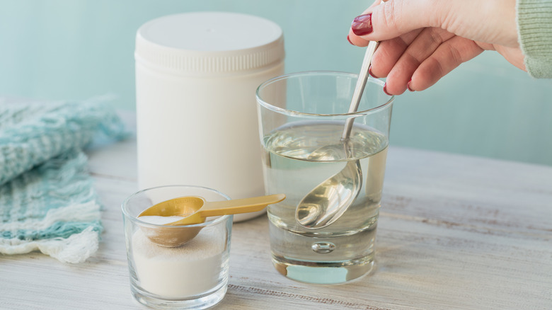 Person stirring collagen into water