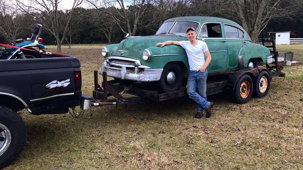 Ethan Plath with one of his restored cars