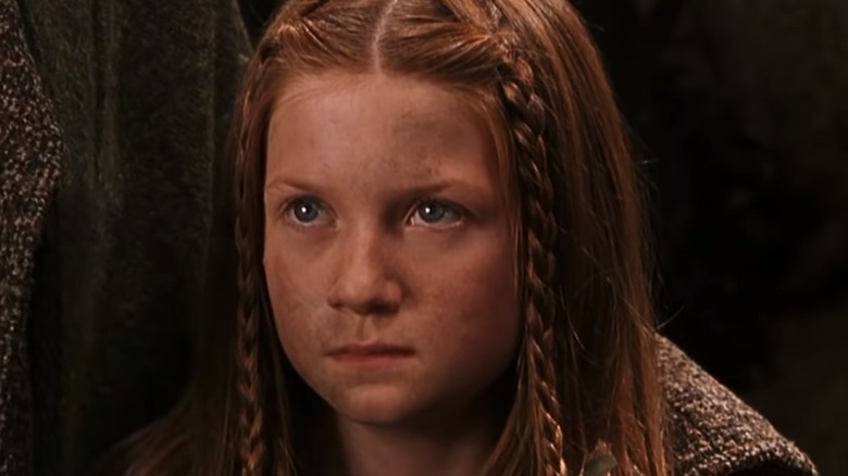 Bonnie Wright as Ginny Weasley looking determined