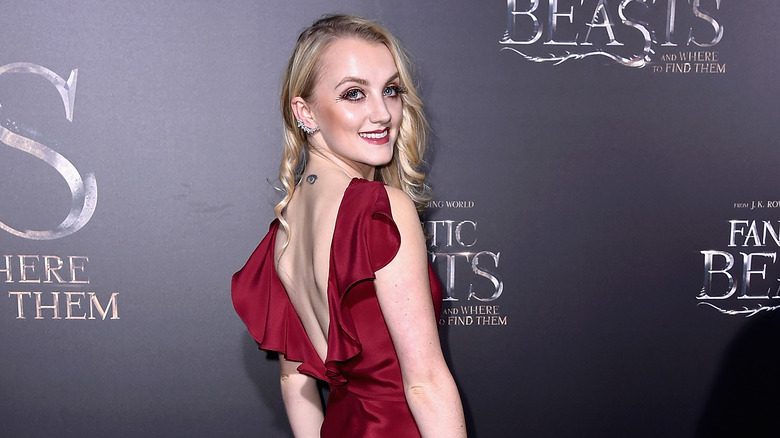 Evanna Lynch in a red dress