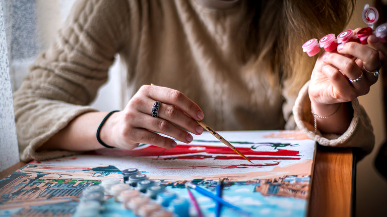 a woman painting