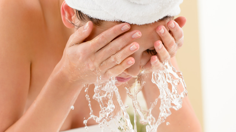 woman washing face