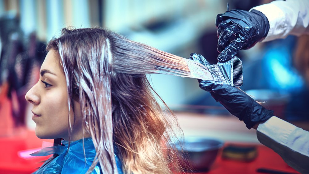 woman getting her hair dyed