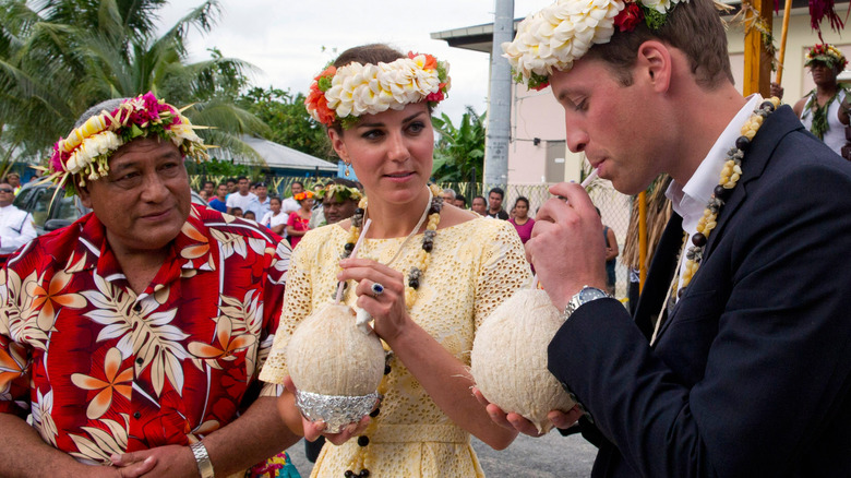 Kate and William drinking coconut milk