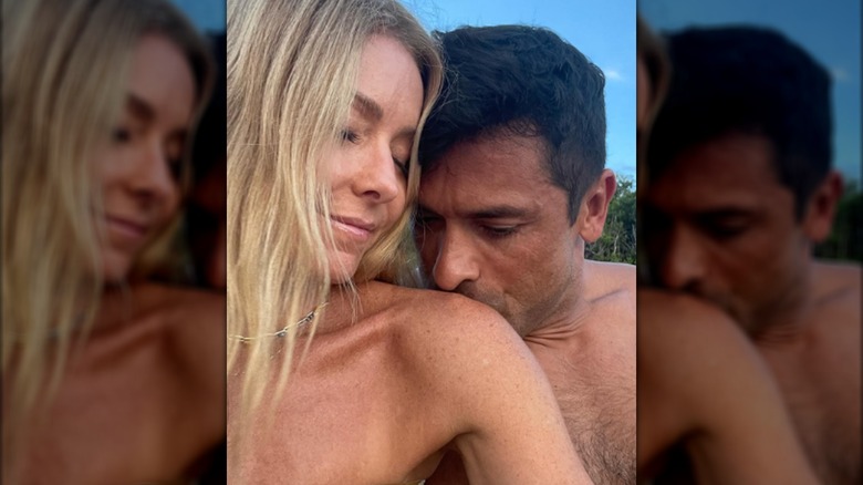 Mark Consuelos kissing Kelly Ripa