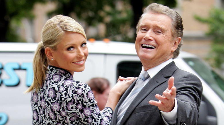 Kelly Ripa and Regis Philbin laughing