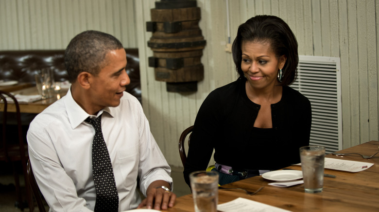 Michelle Obama and Barack Obama at dinner table