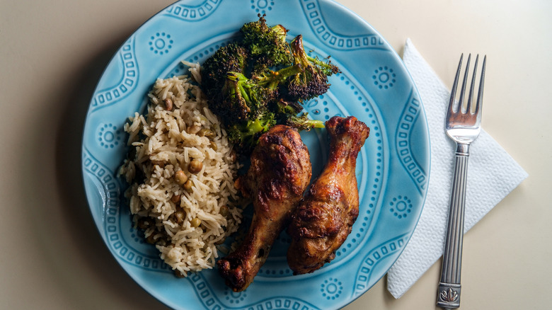 Chicken drumsticks, rice, and broccoli