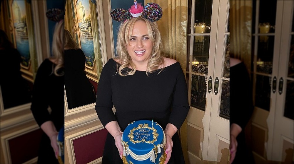 Rebel Wilson holding a birthday cake