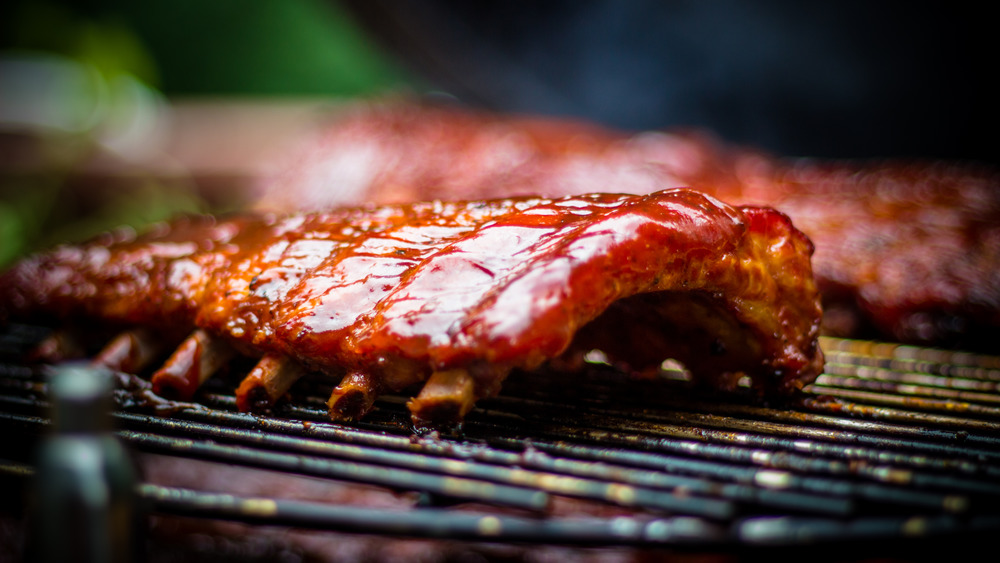 Spare ribs with sauce cooked on a grill