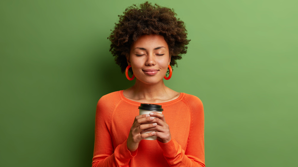 Woman holding coffee